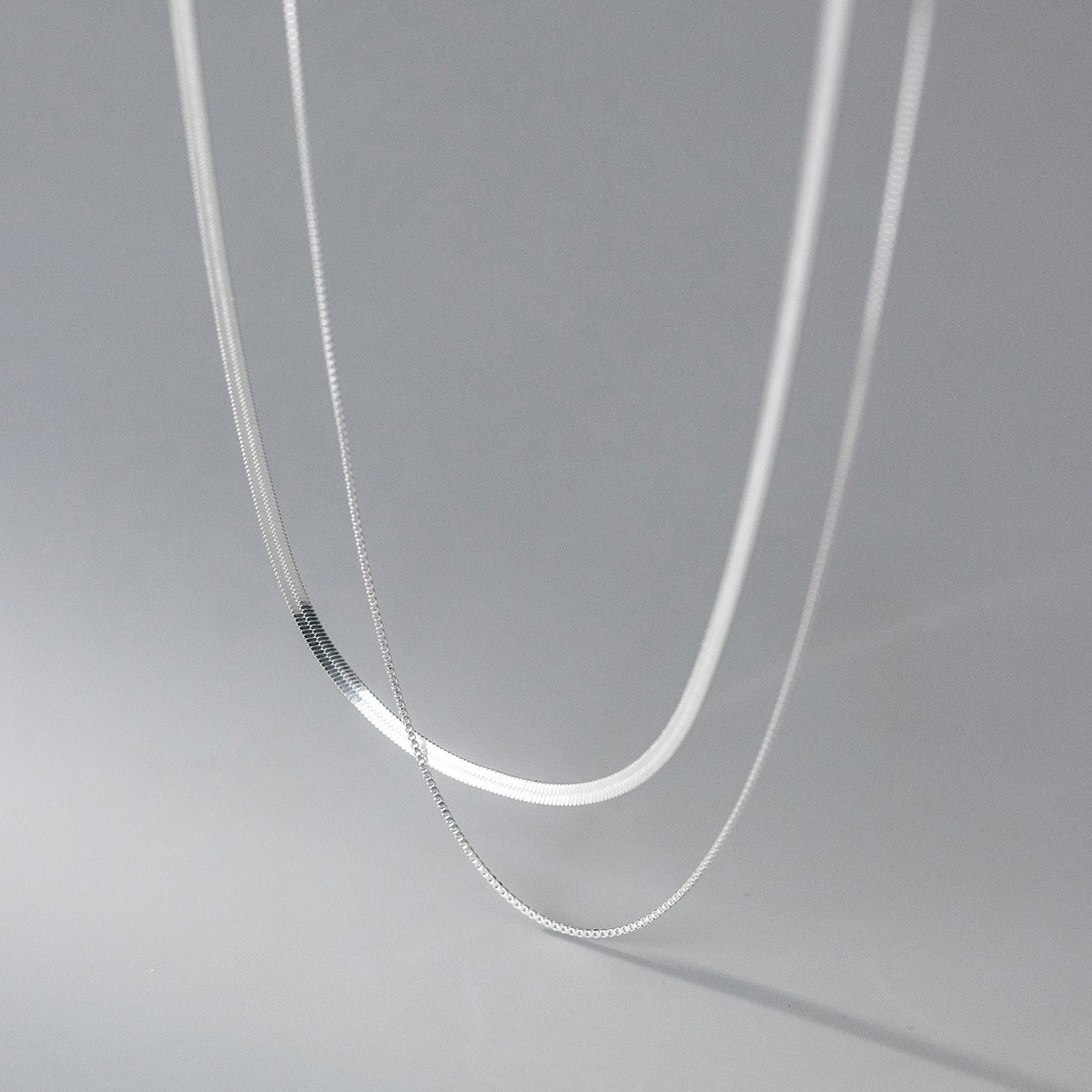 Norelia - Halsband med dubbla kedjor i olika längder